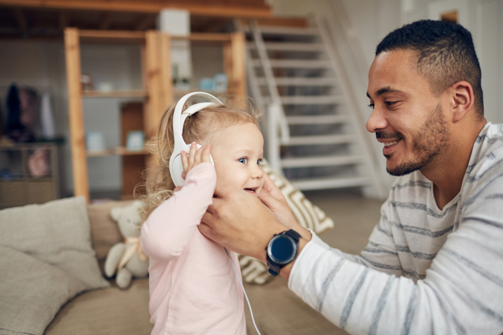 Little Girl Listening to Music with her father