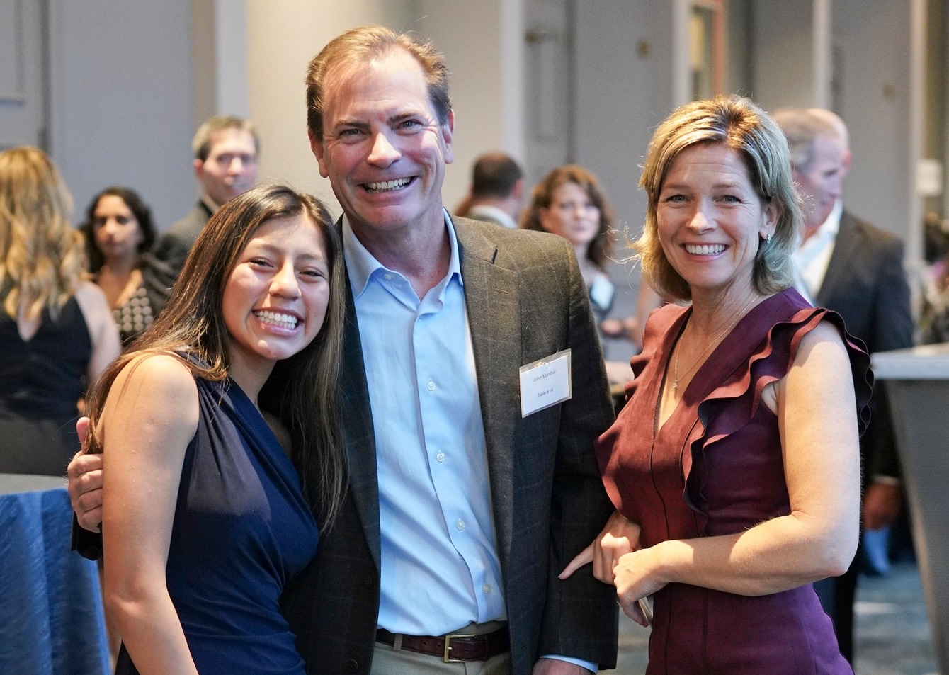 Family smiling at annual gala