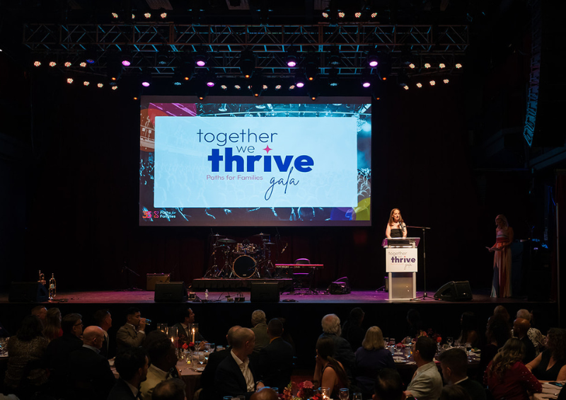 Executive director Lisa Dominguez speaks at the podium at the 2025 gala
